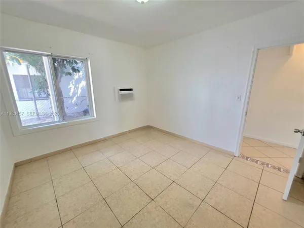 a view of an empty room and window