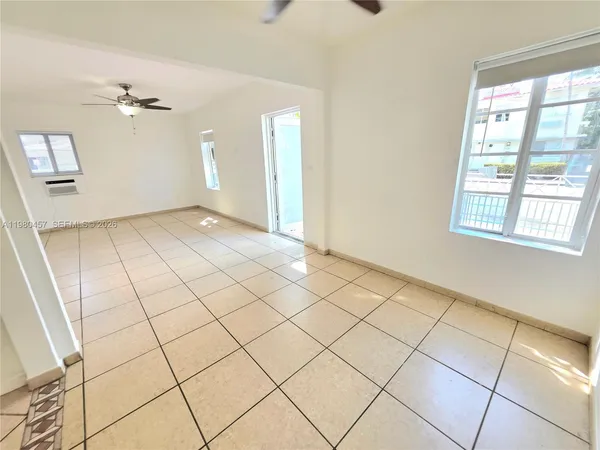 a view of an empty room and window