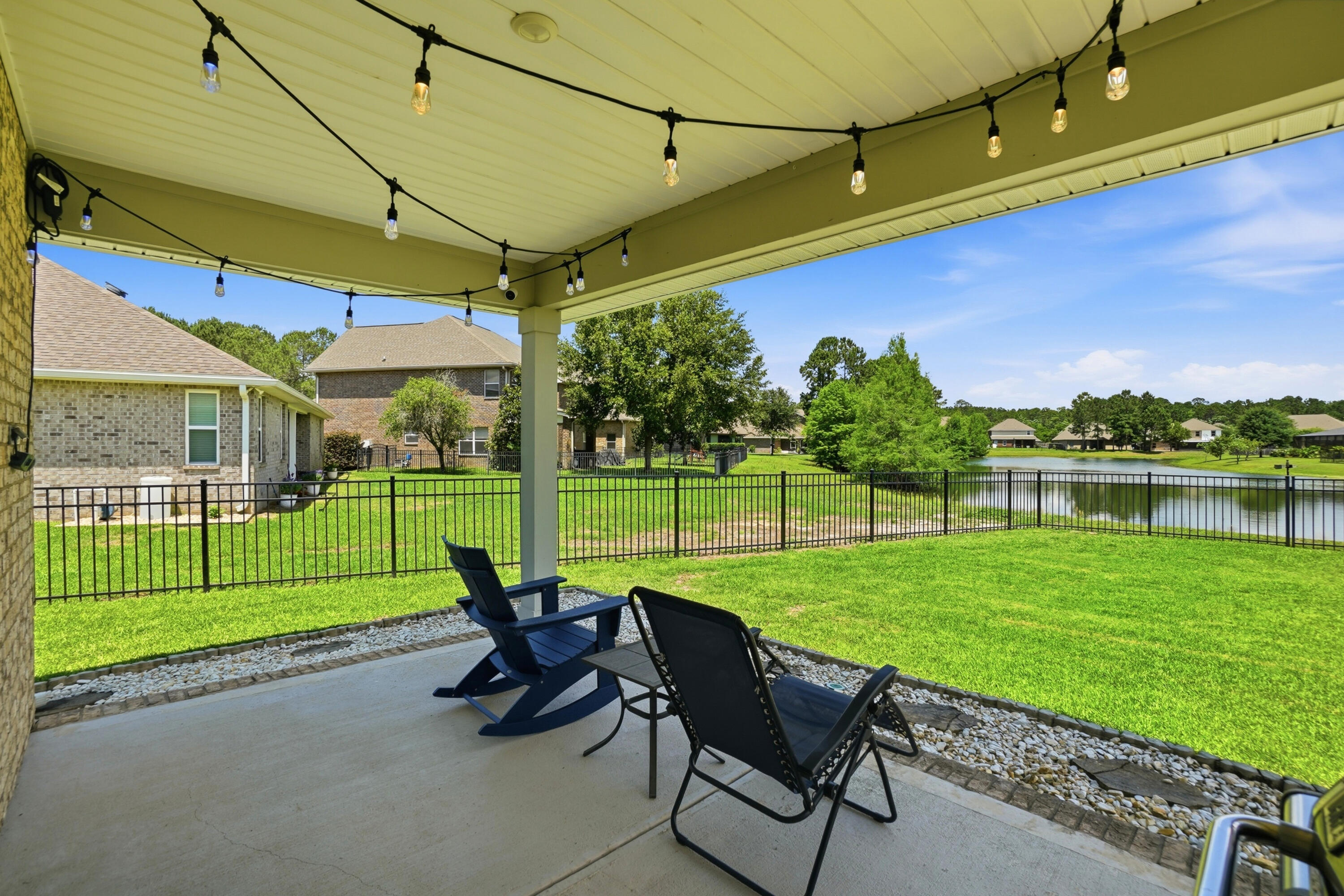 525 Windchime Way Freeport, FL 32439 - Photo 29 of 59 a view of a chair and table in the garden