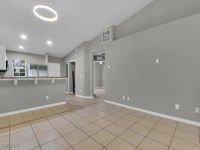 a kitchen with stainless steel appliances granite countertop a stove and a sink