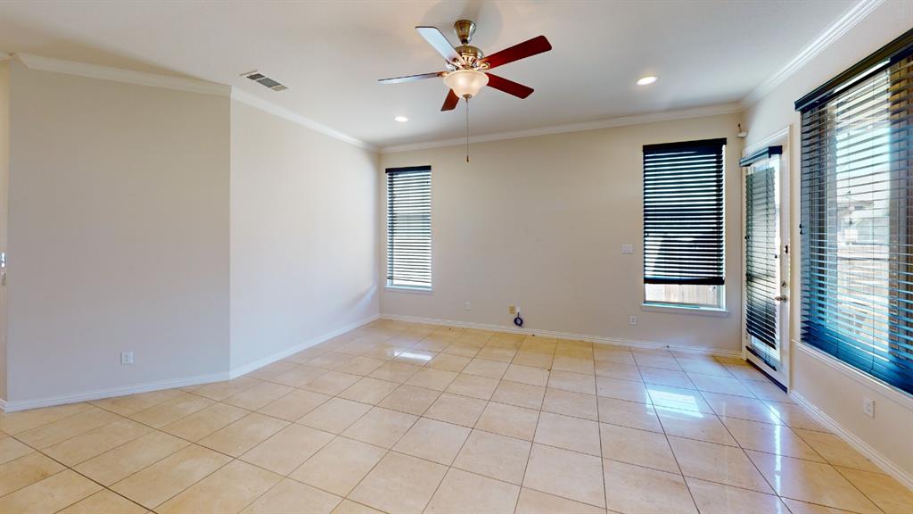 14712 Spitfire Trail Fort Worth, TX 76262 - Photo 10 of 25 Spacious interior featuring large format tile flooring, crown molding, and recessed lighting
