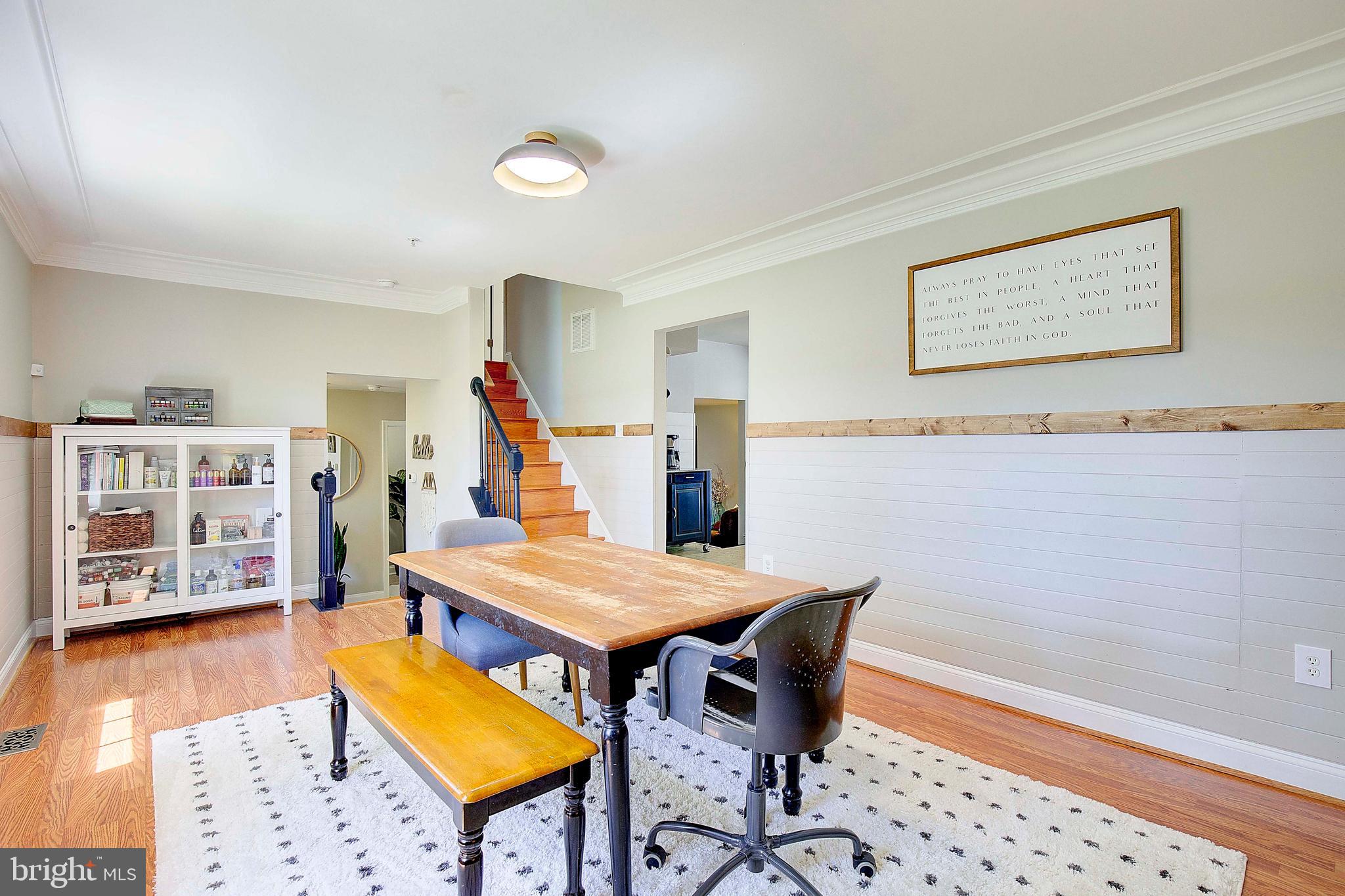 7006 Prout Road Friendship, MD 20758 - Photo 11 of 48 a view of a dining room with furniture and wooden floor