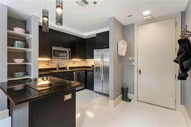 a kitchen with a refrigerator stove and microwave