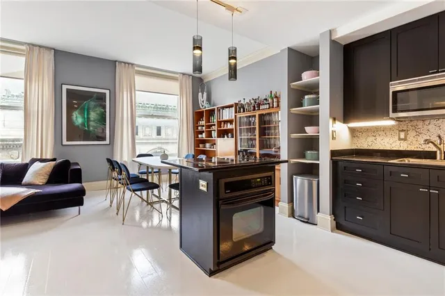a kitchen with stainless steel appliances granite countertop a stove and a refrigerator