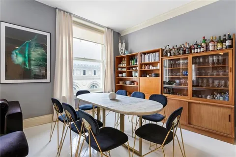 a view of a dining room with furniture window and outside view