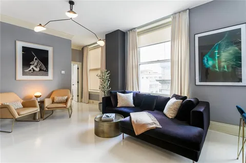 a workspace with furniture and a window