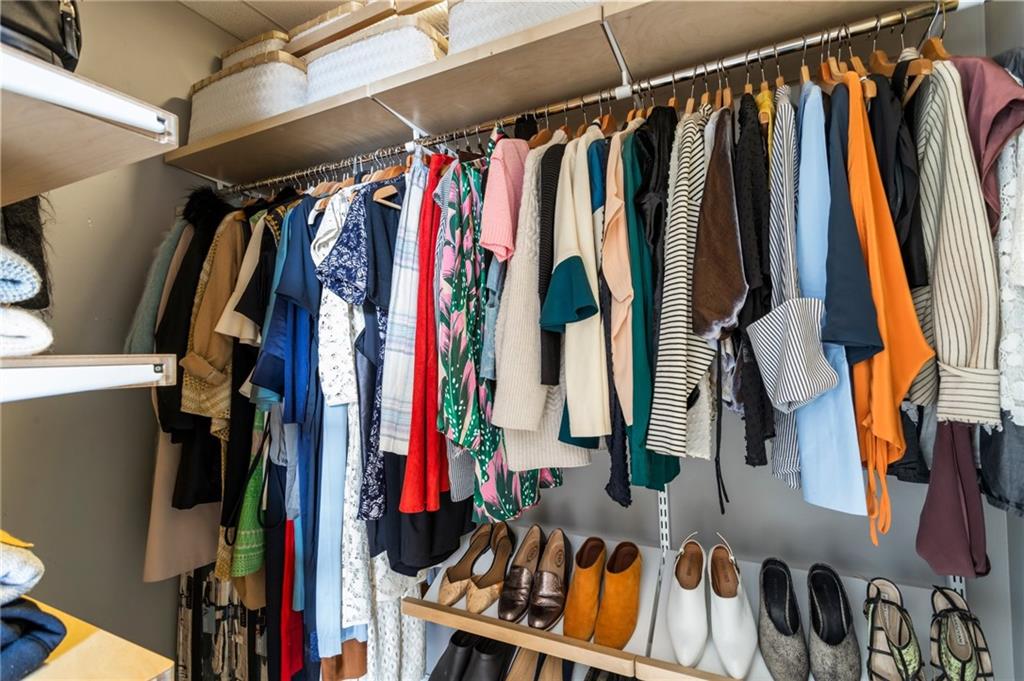 57 Forsyth Street Northwest, Unit 5F Atlanta, GA 30303 - Photo 39 of 44 a view of walk in closet with clothes and shoes
