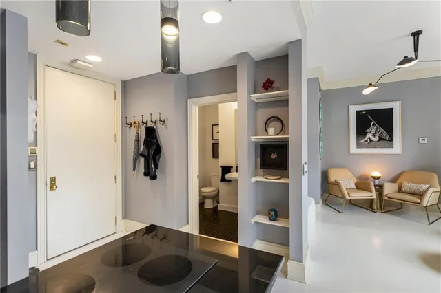 a bathroom with a sink toilet and mirror