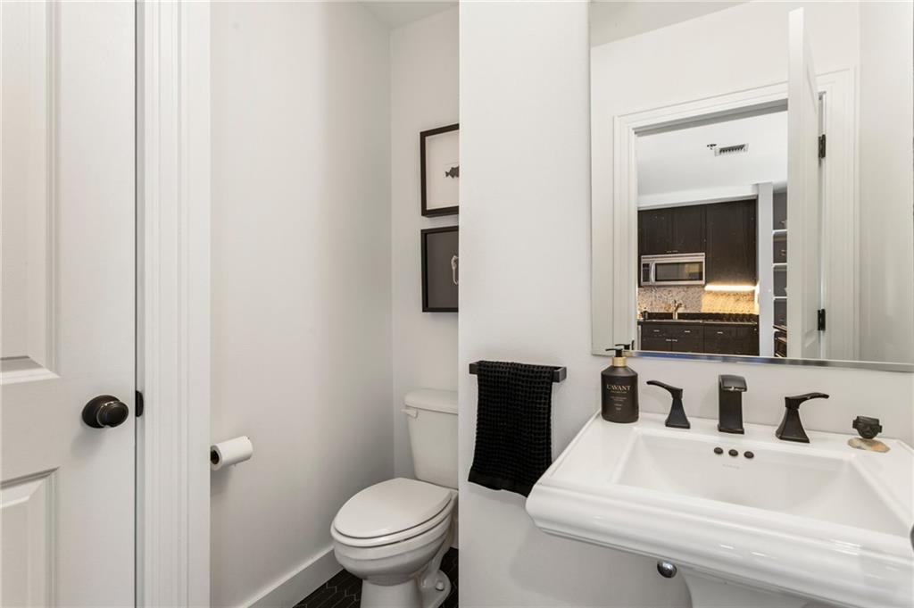 57 Forsyth Street Northwest, Unit 5F Atlanta, GA 30303 - Photo 42 of 44 a bathroom with a sink toilet and mirror