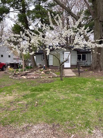 a view of a house with backyard porch and sitting area