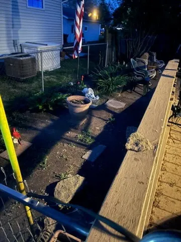 a view of a garden with sitting area