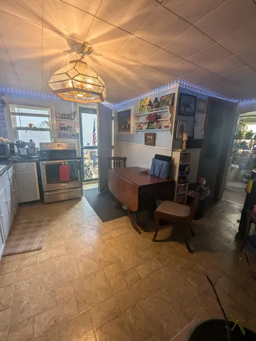 a large kitchen with a large counter top appliances and cabinets