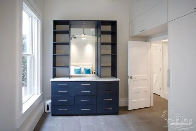 a front view of a house with a yard table and chairs