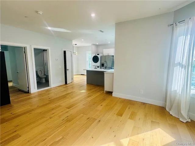 a view of a kitchen with a sink and cabinets