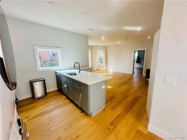 a spacious bathroom with a double vanity sink and a mirror