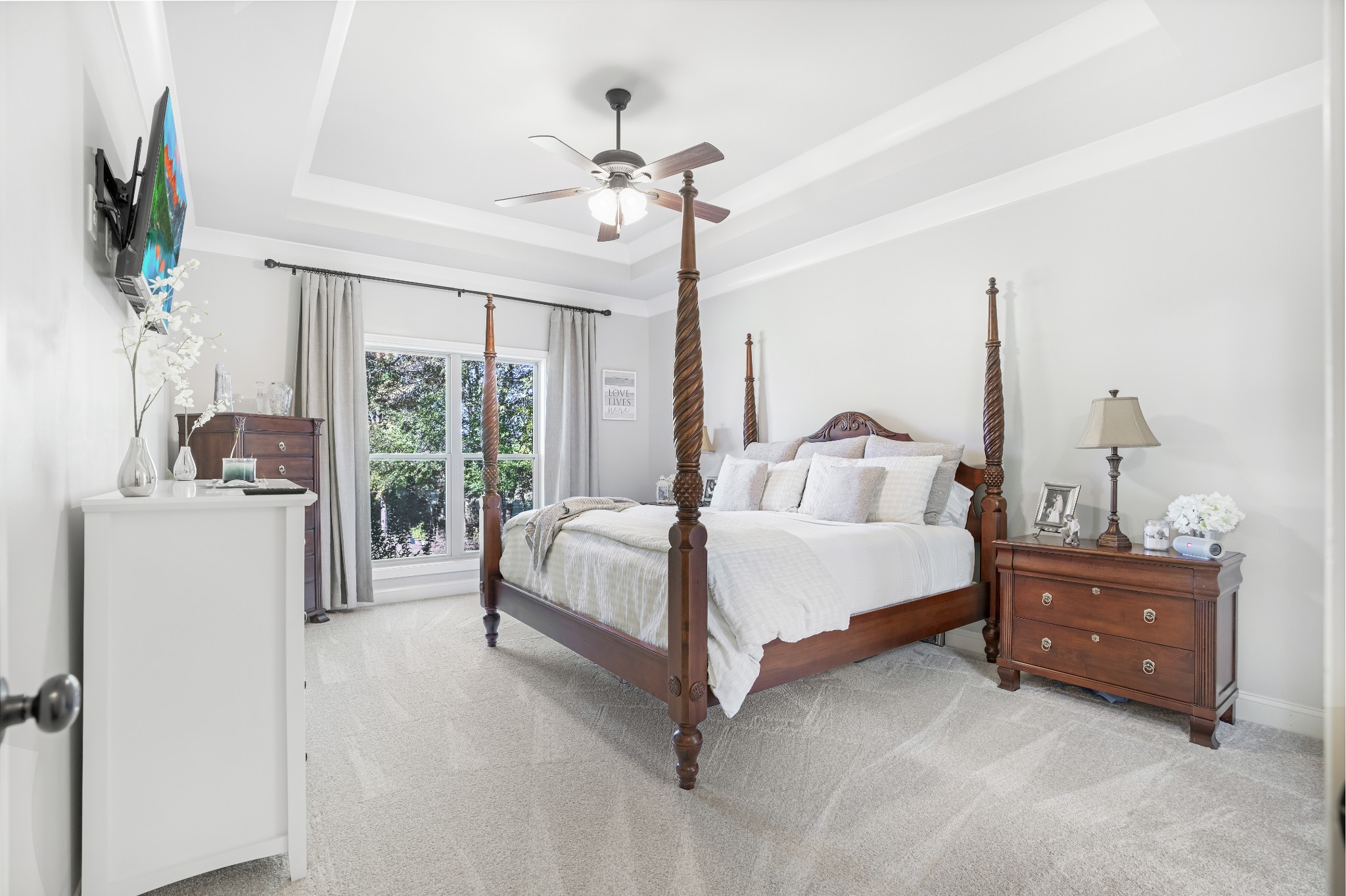 5065 Pickering Road Clarksville, TN 37043 - Photo 14 of 35 a spacious bedroom with a bed window and flat screen tv