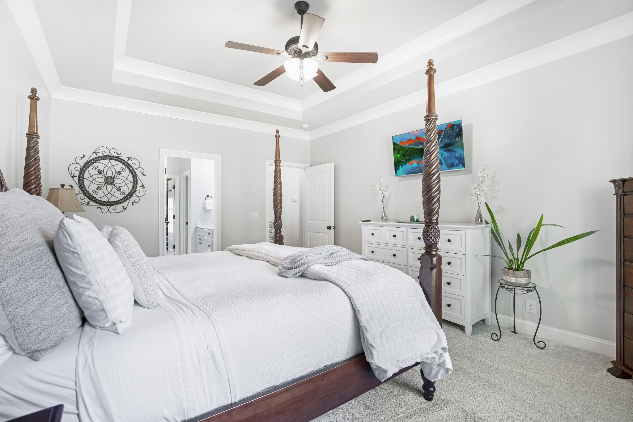 5065 Pickering Road Clarksville, TN 37043 - Photo 15 of 35 a spacious bedroom with a bed and a chandelier