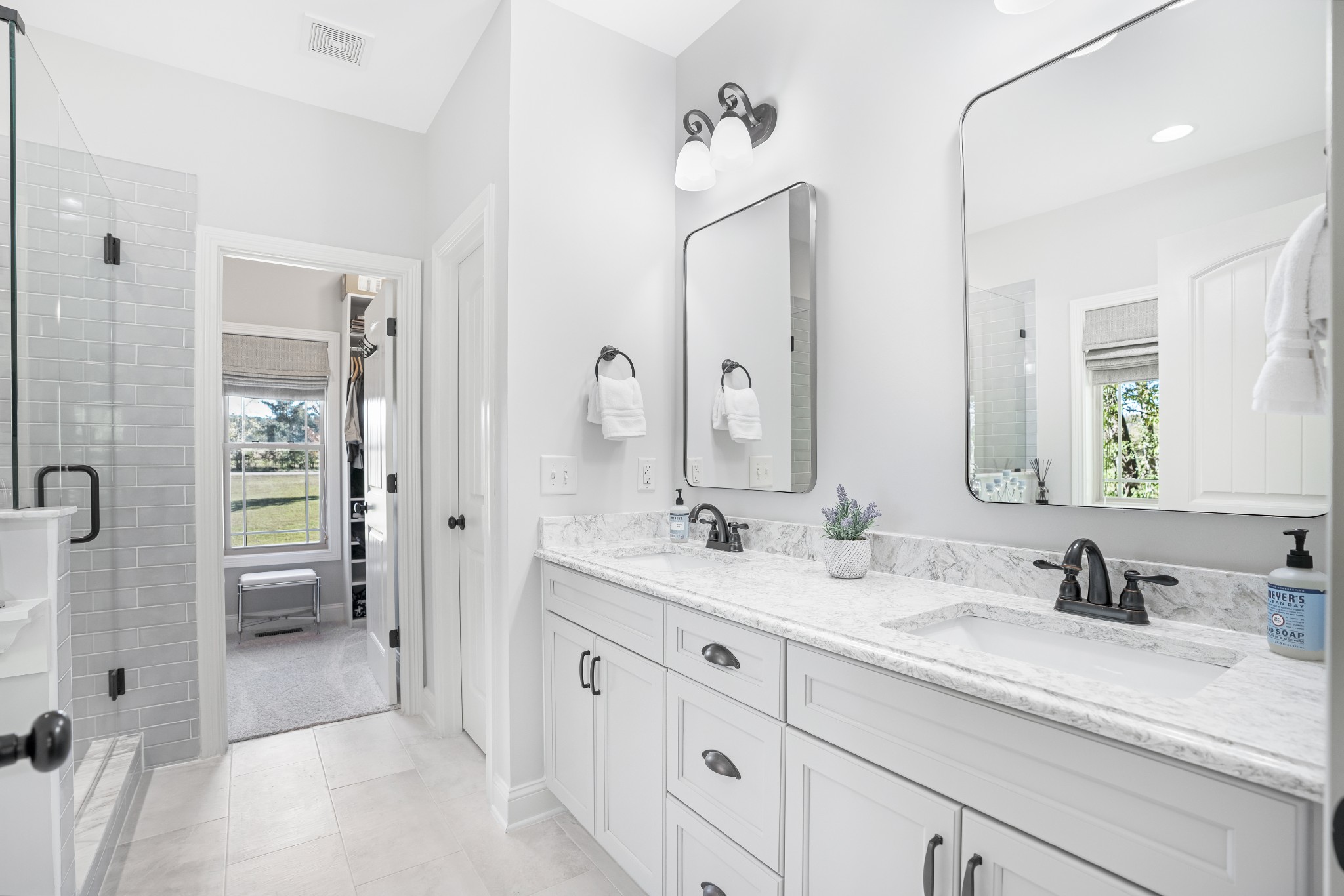 5065 Pickering Road Clarksville, TN 37043 - Photo 16 of 35 a spacious bathroom with a granite countertop sink mirror and shower