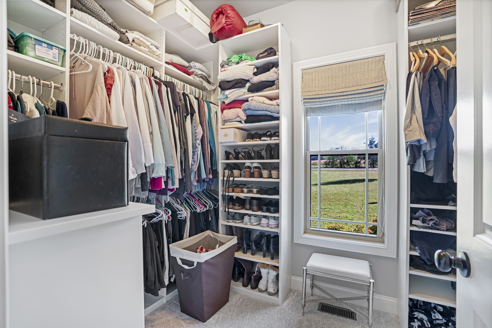 5065 Pickering Road Clarksville, TN 37043 - Photo 18 of 35 a view of walk in closet with clothes and shoes