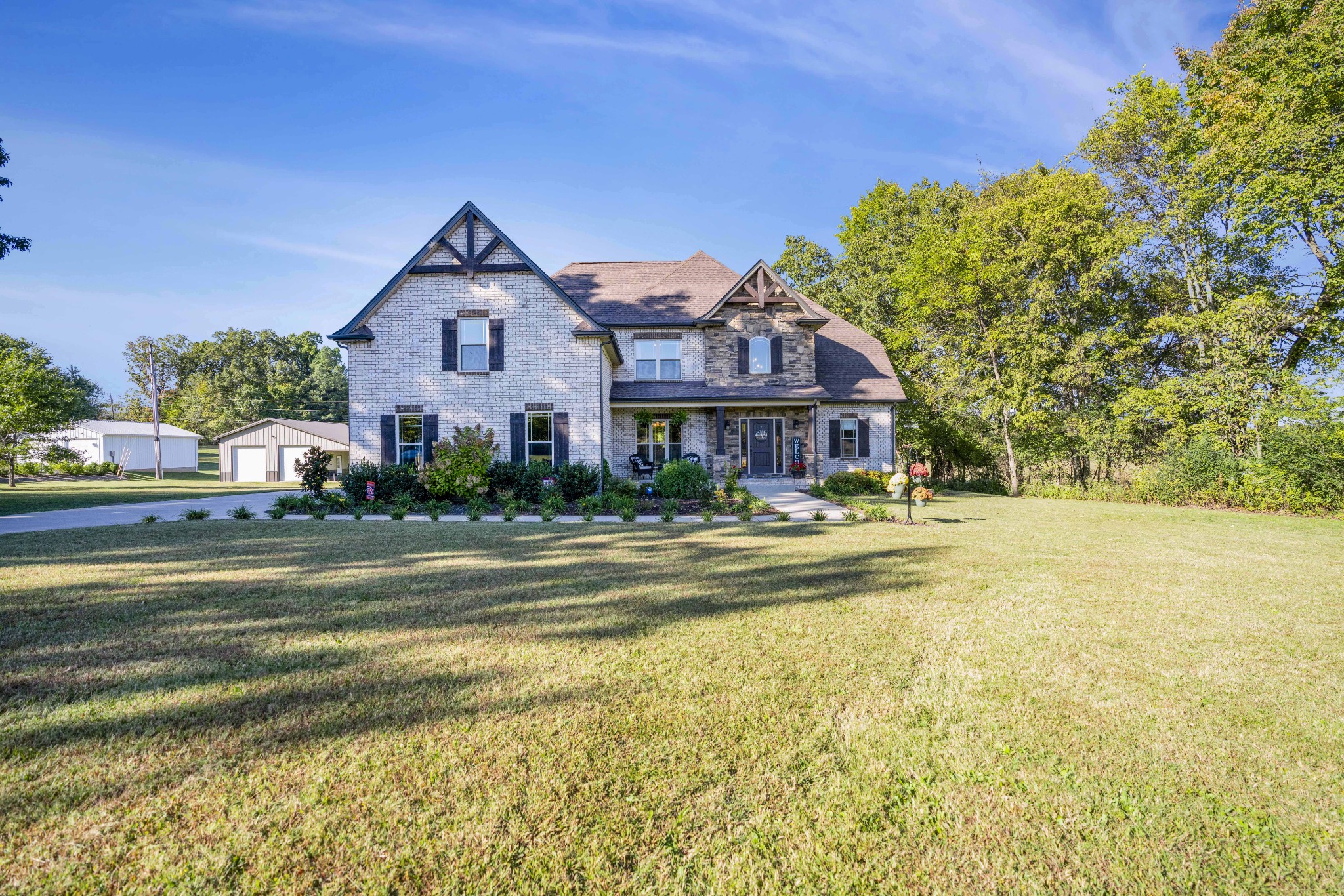 5065 Pickering Road Clarksville, TN 37043 - Photo 2 of 35 a front view of a house with swimming pool and porch