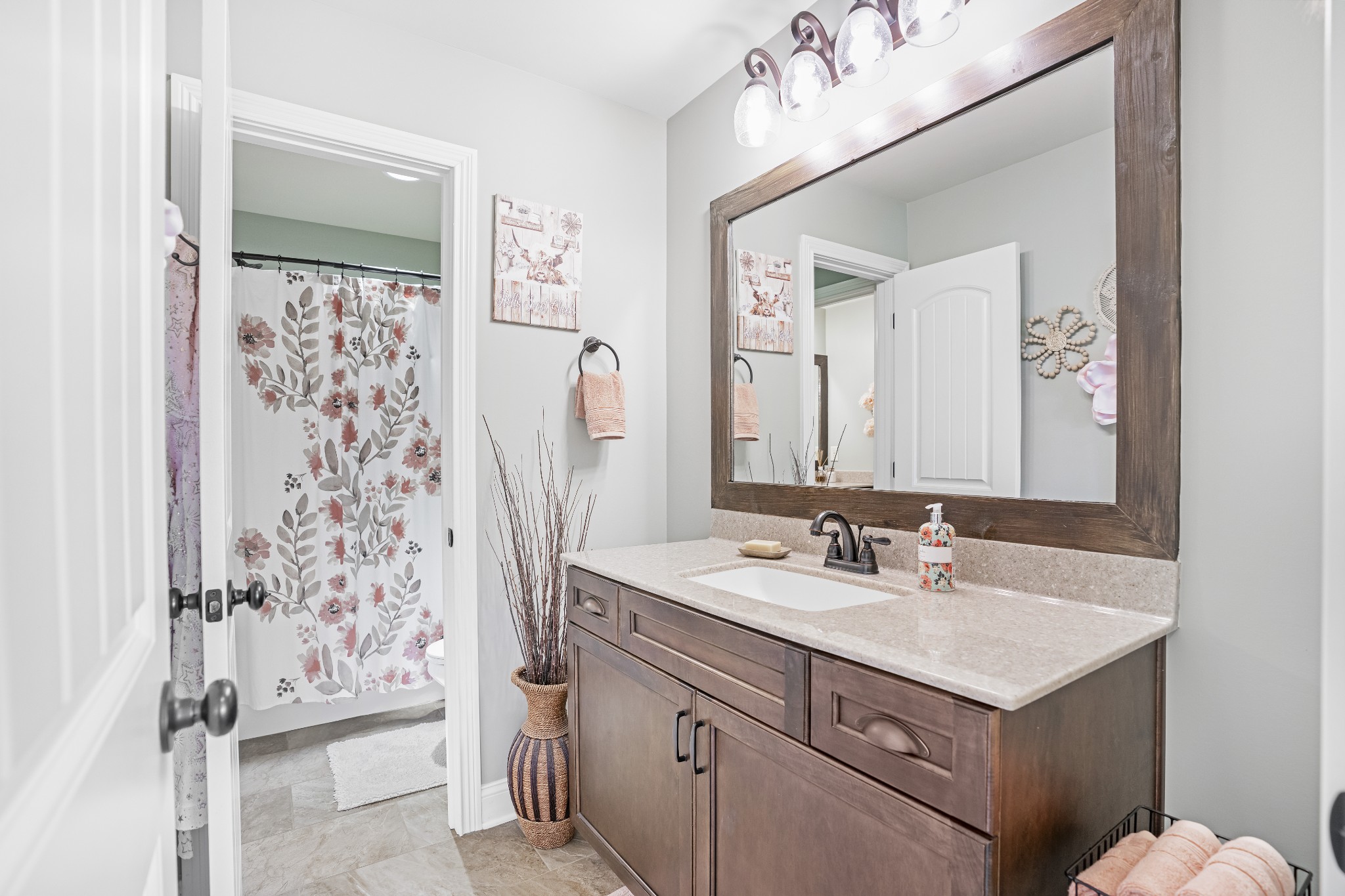5065 Pickering Road Clarksville, TN 37043 - Photo 22 of 35 a bathroom with a sink vanity and a mirror