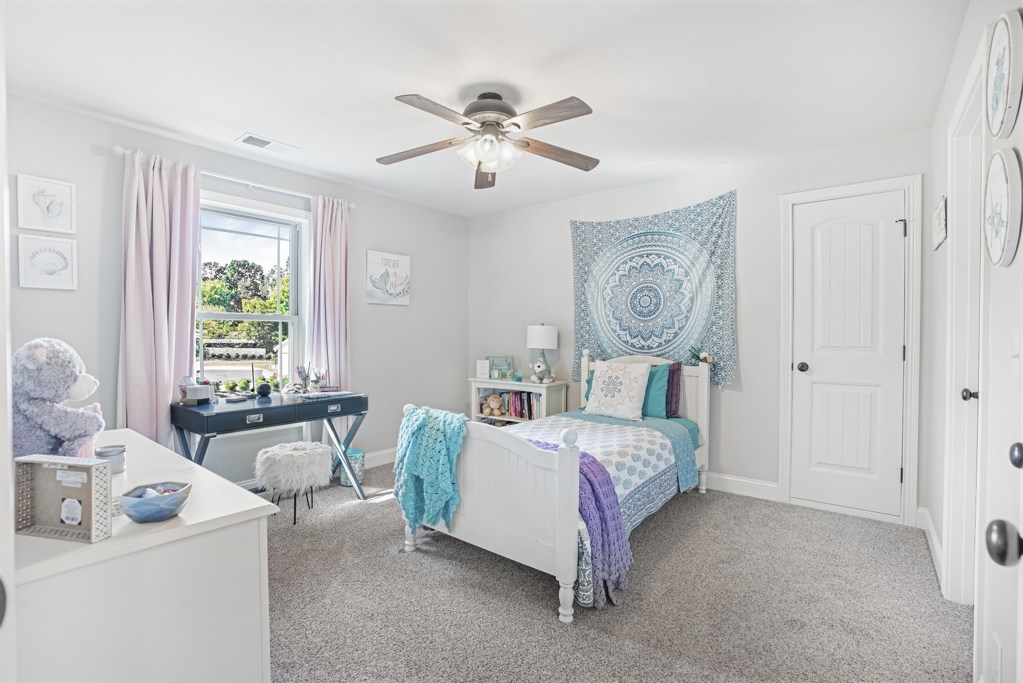 5065 Pickering Road Clarksville, TN 37043 - Photo 25 of 35 a bed room with a bed and a chandelier