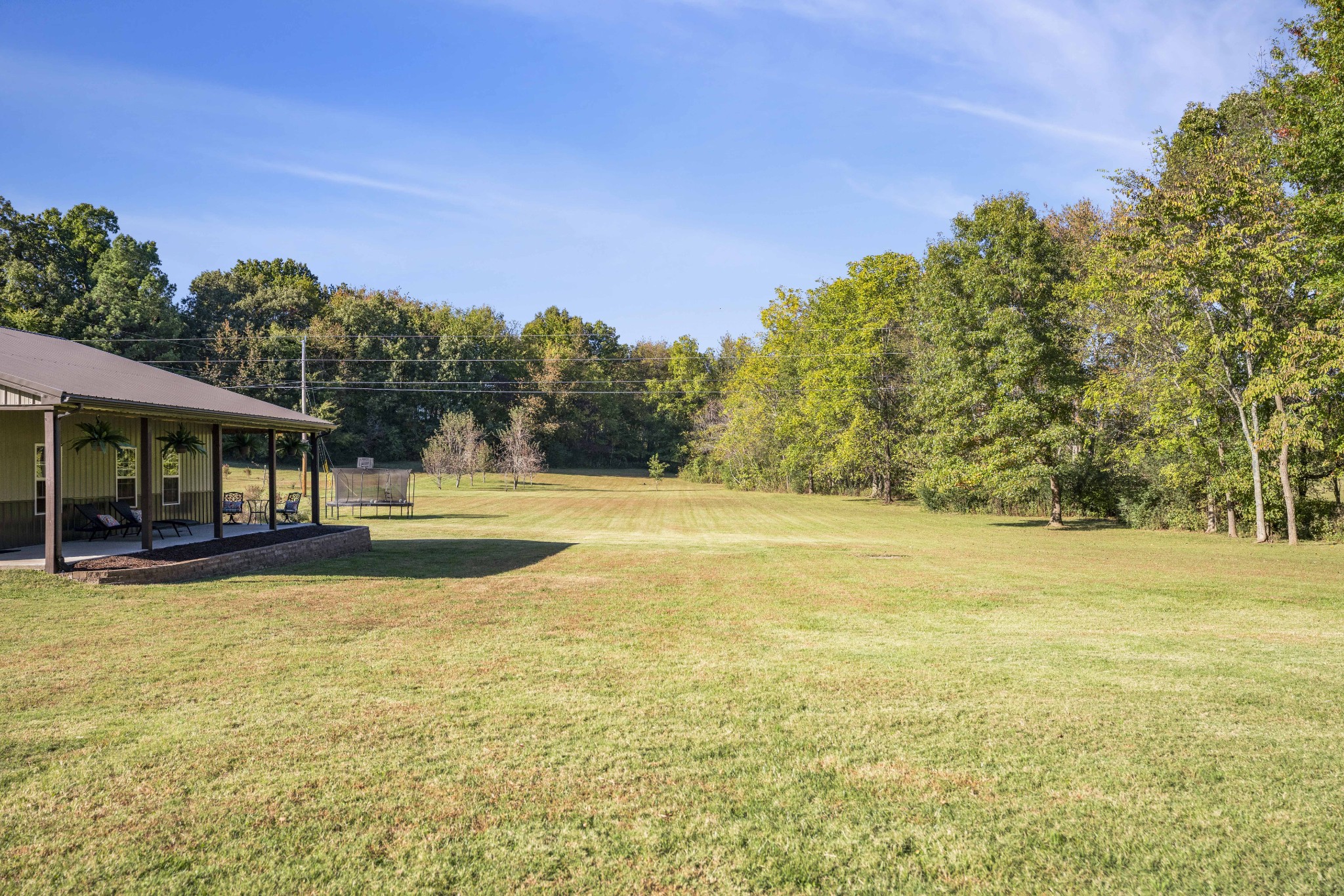 5065 Pickering Road Clarksville, TN 37043 - Photo 33 of 35 a view of a swimming pool with an outdoor seating and a yard