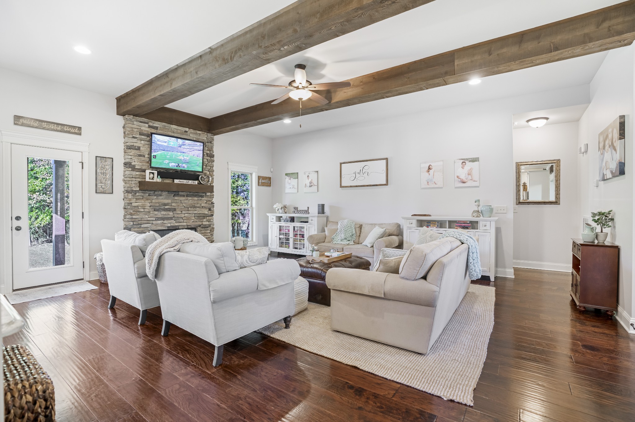 5065 Pickering Road Clarksville, TN 37043 - Photo 7 of 35 a living room with furniture wooden floor and a fireplace