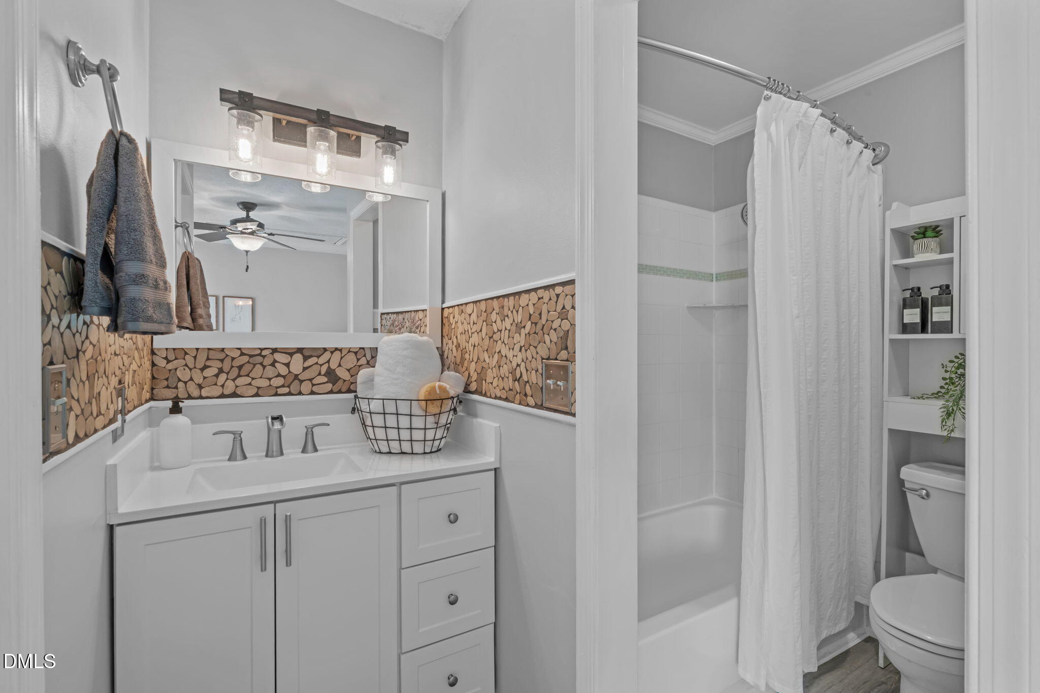 203 Oak Hollow Court Raleigh, NC 27613 - Photo 29 of 37 a bathroom with a sink toilet and shower