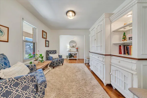 a large kitchen with stainless steel appliances granite countertop a lot of counter space and wooden floors