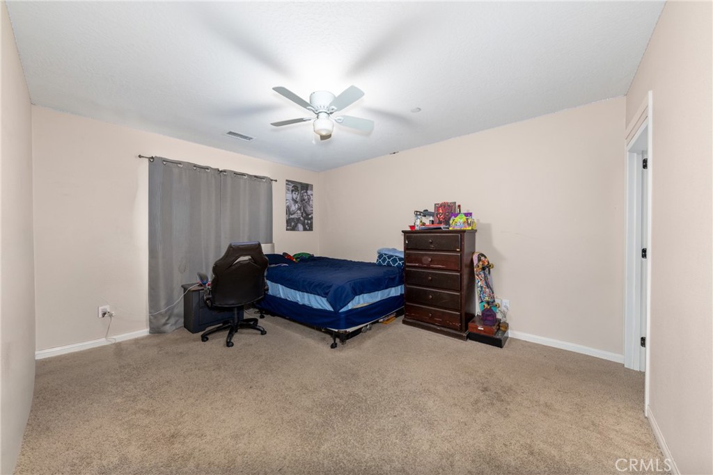 14632 Maricopa Road Victorville, CA 92392 - Photo 22 of 43 a living room with furniture and a air conditioner vent