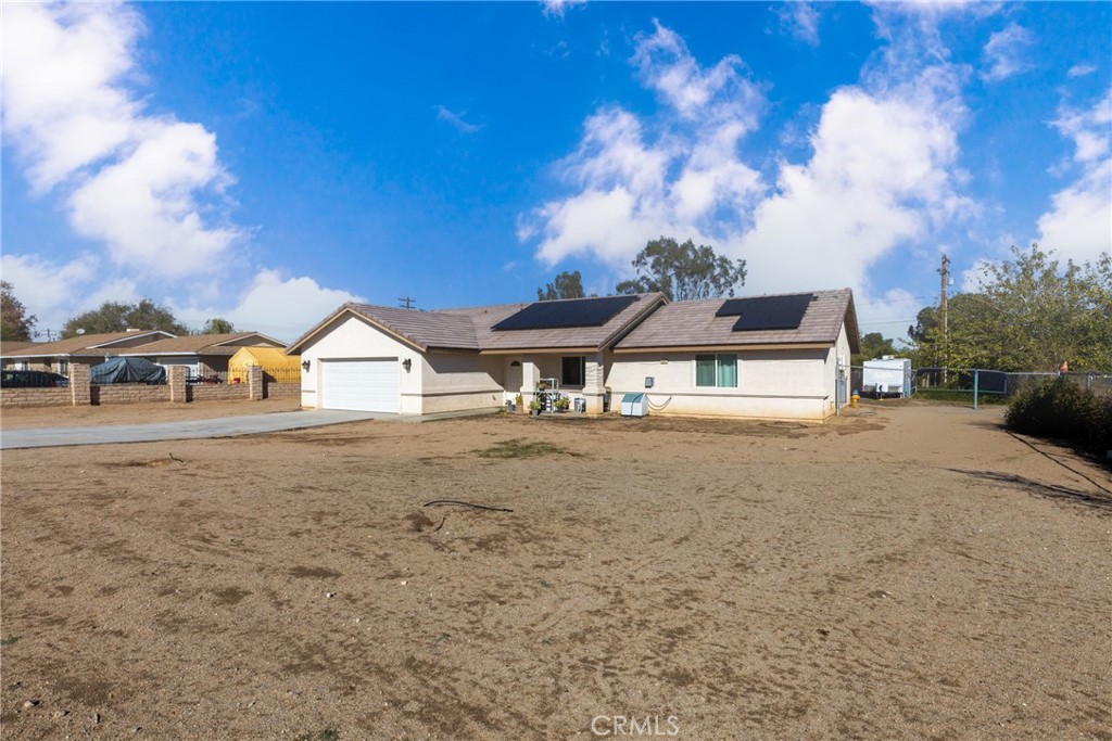 14632 Maricopa Road Victorville, CA 92392 - Photo 23 of 43 a view of house with outdoor space and swimming pool