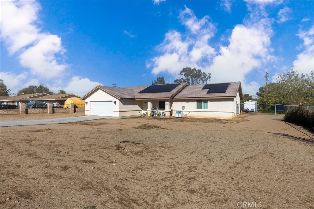 14632 Maricopa Road Victorville, CA 92392 - Photo 23 of 43 a view of house with outdoor space and swimming pool