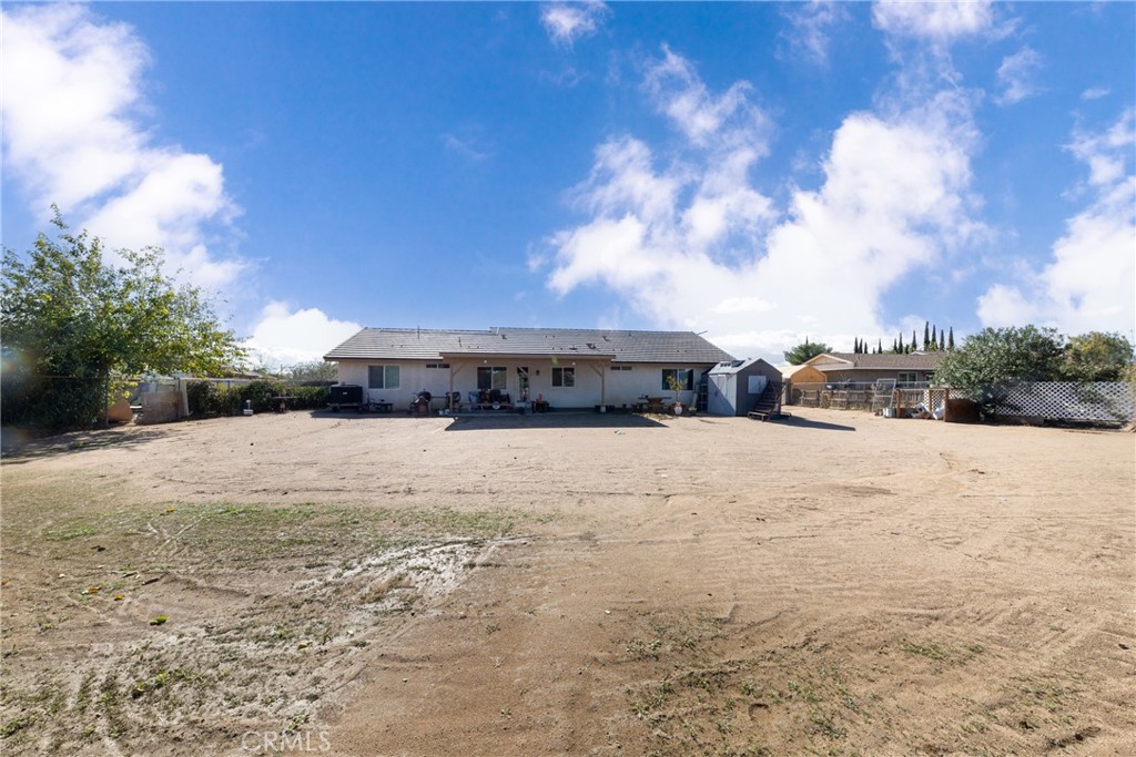 14632 Maricopa Road Victorville, CA 92392 - Photo 28 of 43 a view of a house with a yard