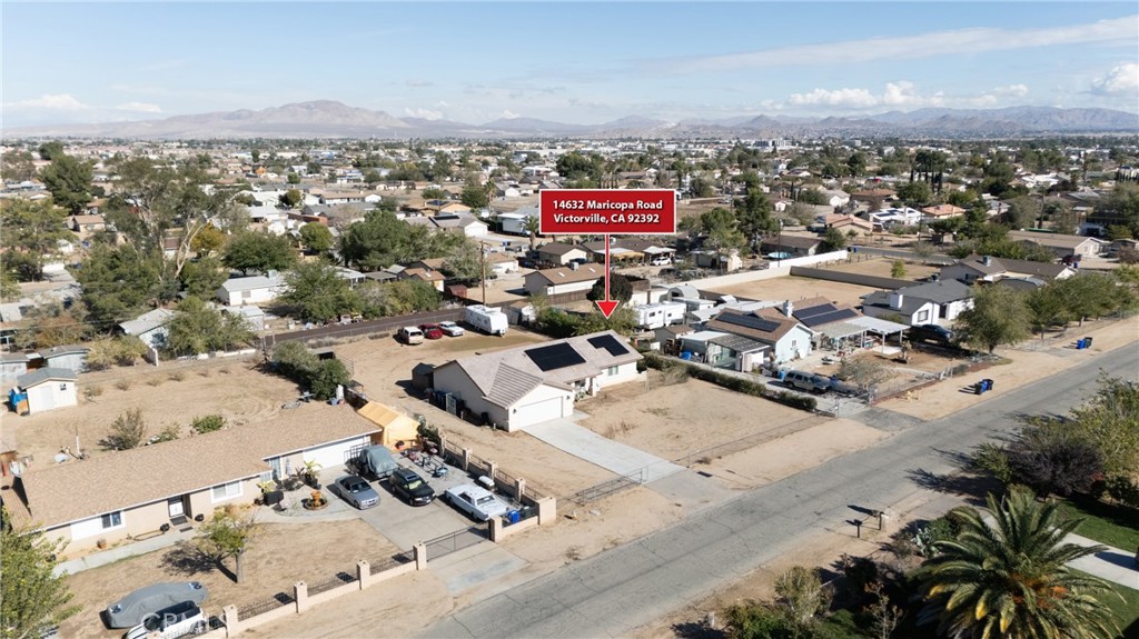 14632 Maricopa Road Victorville, CA 92392 - Photo 33 of 43 an aerial view of residential houses with outdoor space