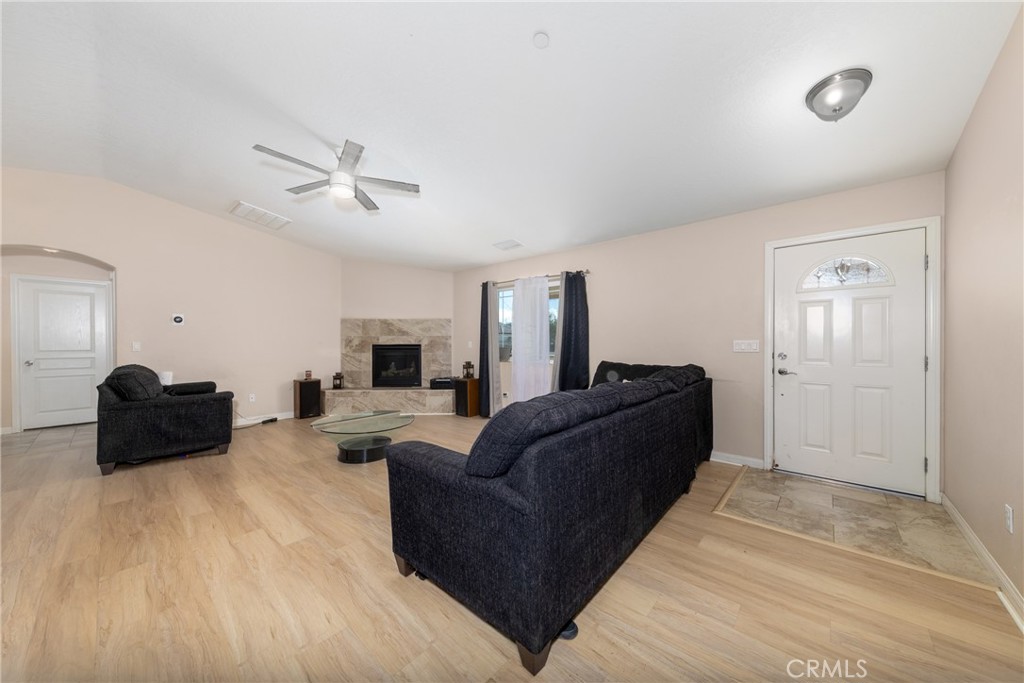 14632 Maricopa Road Victorville, CA 92392 - Photo 7 of 43 a living room with furniture and a flat screen tv