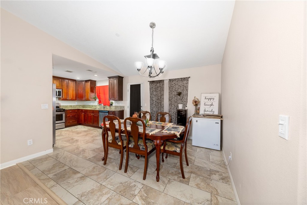 14632 Maricopa Road Victorville, CA 92392 - Photo 9 of 43 a view of a dining room with furniture and chandelier