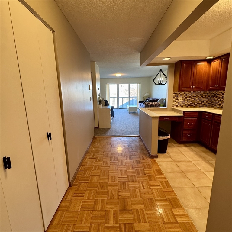 915 Hathaway Road, Unit 105 New Bedford, MA 02740 - Photo 2 of 24 a large room with wooden floor