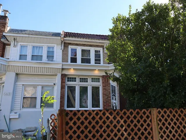 a front view of a house having yard
