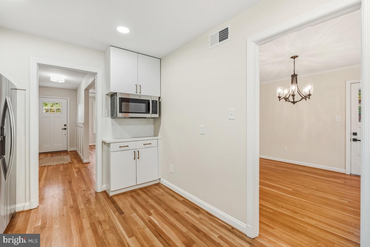 1203 Brantford Avenue Silver Spring, MD 20904 - Photo 12 of 32 a view of a kitchen from the hallway