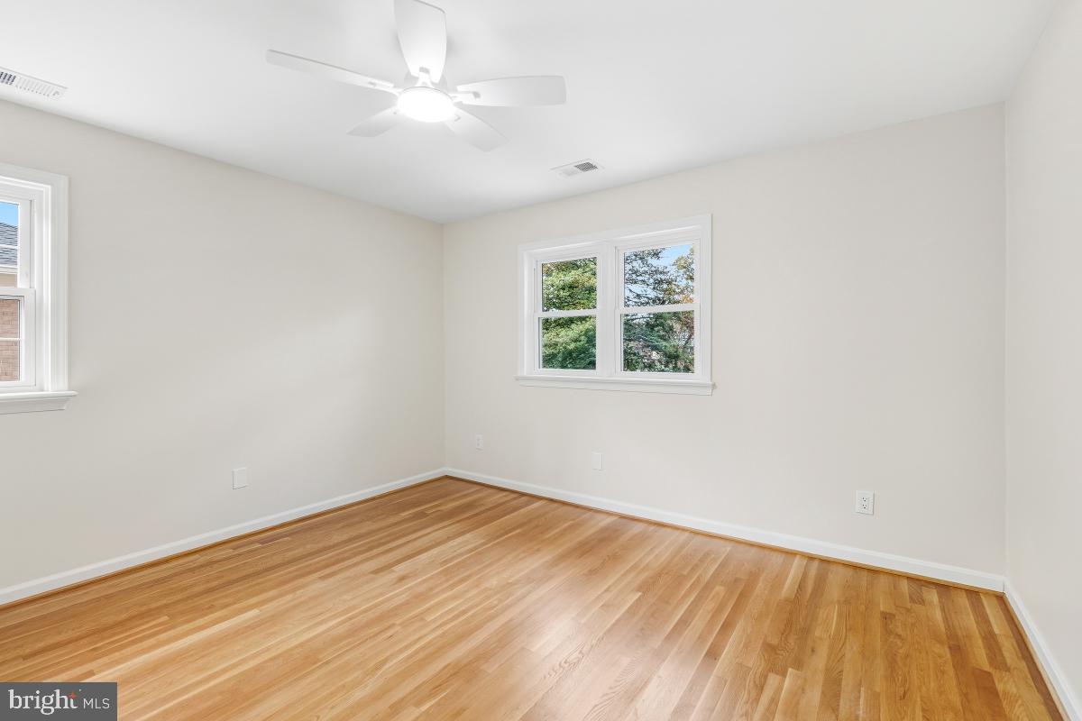 1203 Brantford Avenue Silver Spring, MD 20904 - Photo 17 of 32 wooden floor in an empty room with a window
