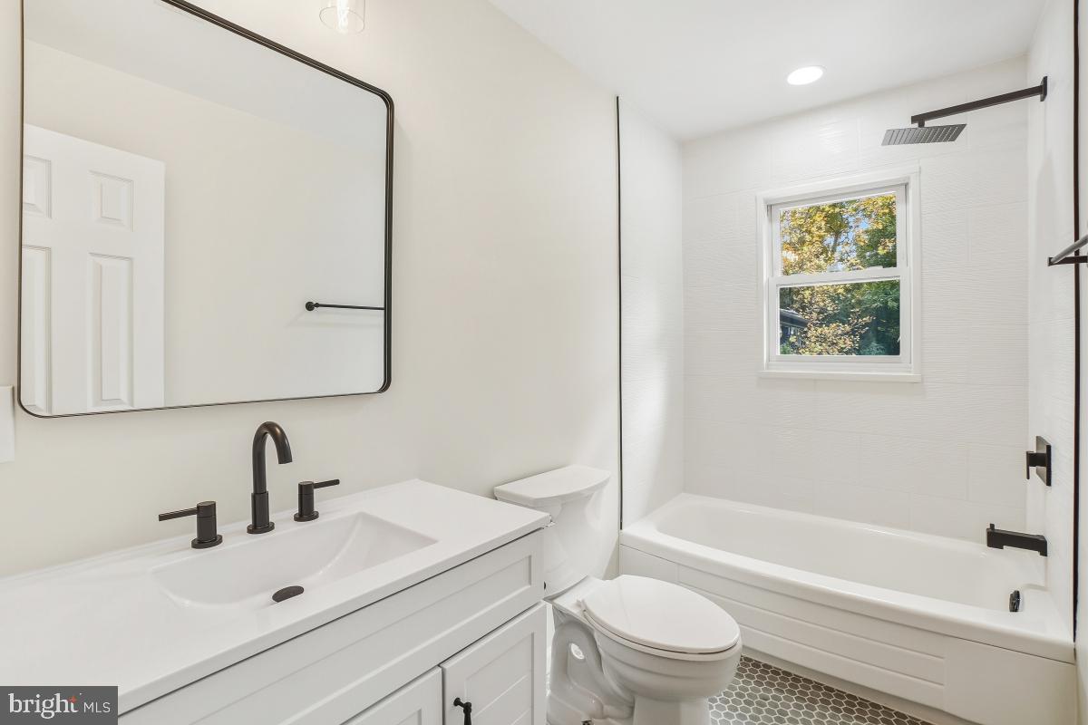 1203 Brantford Avenue Silver Spring, MD 20904 - Photo 18 of 32 a bathroom with a sink a toilet and a bathtub