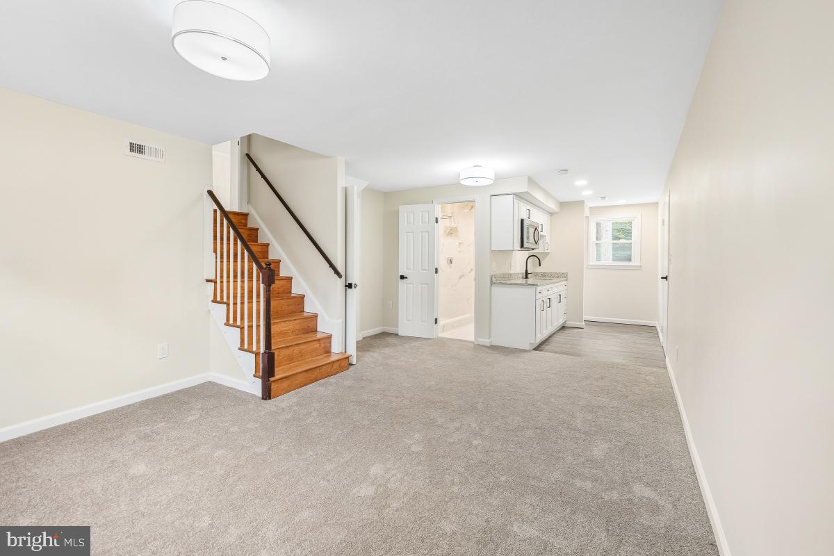 1203 Brantford Avenue Silver Spring, MD 20904 - Photo 19 of 32 a view of a livingroom with a staircase