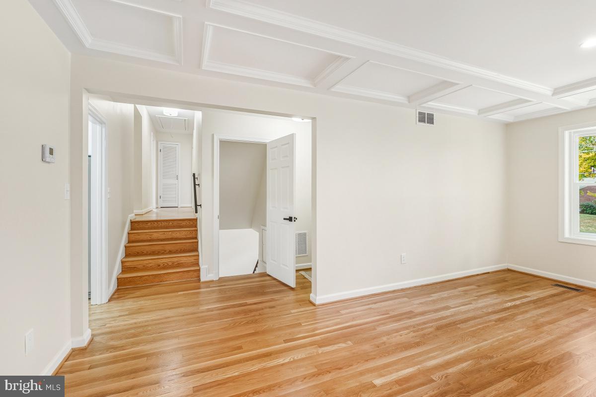 1203 Brantford Avenue Silver Spring, MD 20904 - Photo 7 of 32 a view of a hallway view with wooden floor and staircase