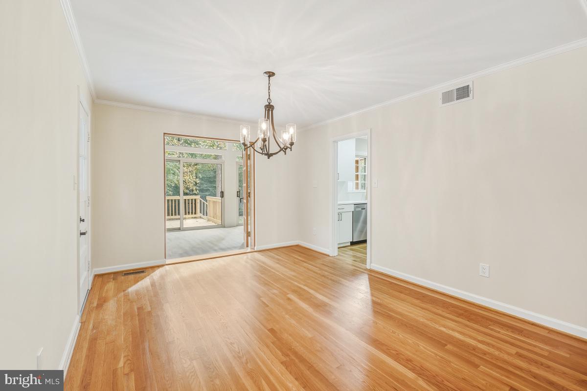 1203 Brantford Avenue Silver Spring, MD 20904 - Photo 8 of 32 a spacious bedroom with a bed and a window