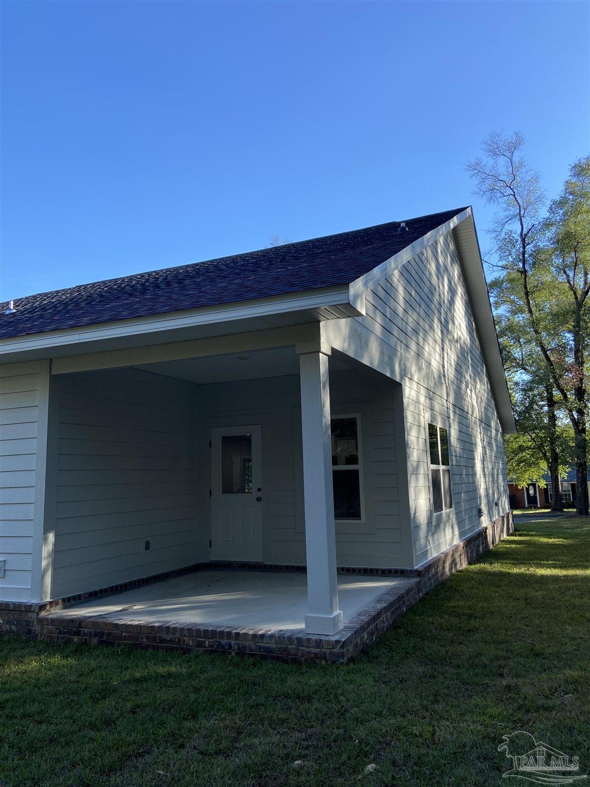 6768 Contentment Street Milton, FL 32583 - Photo 20 of 21 a view of backyard with large trees