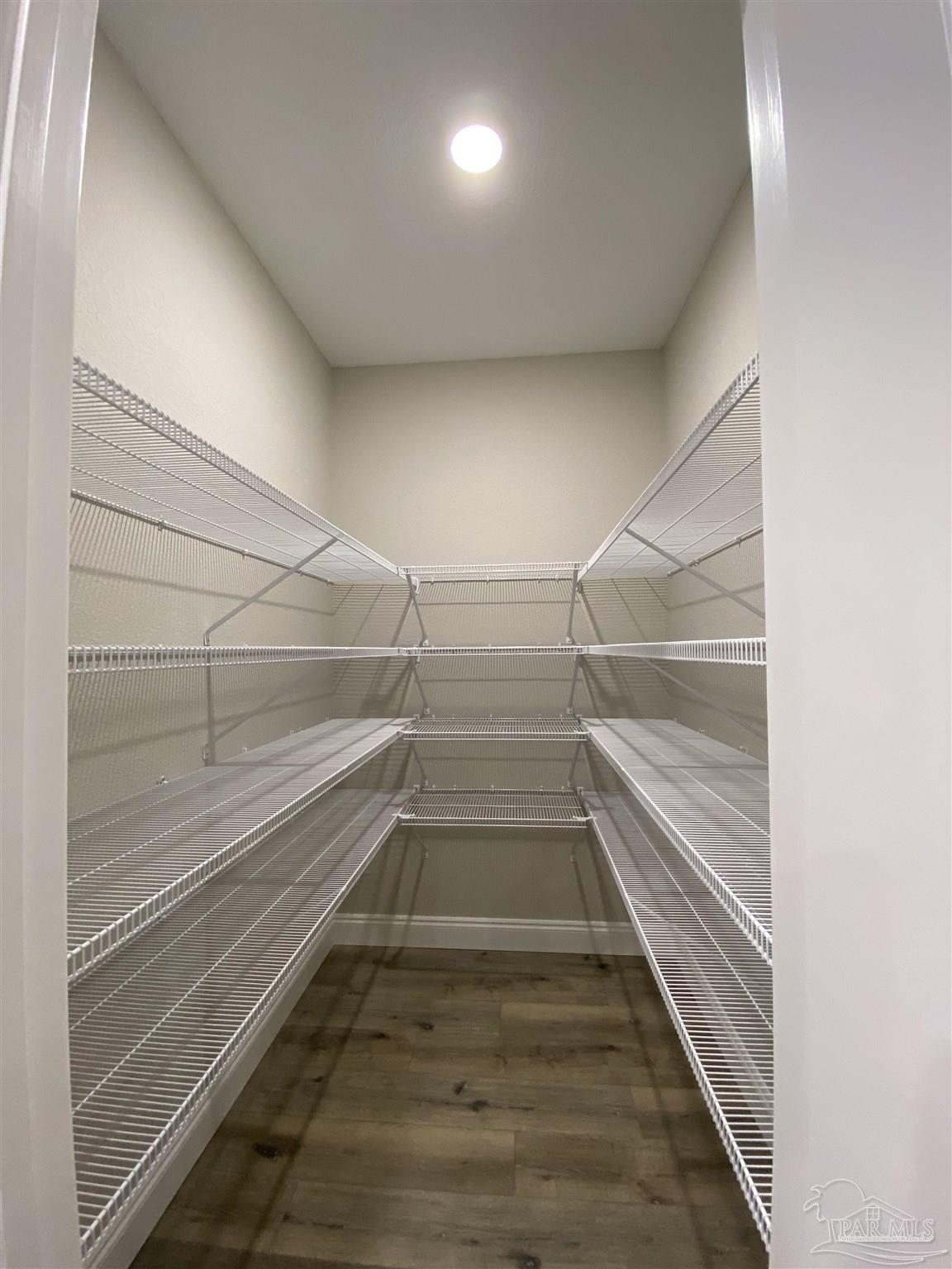 6768 Contentment Street Milton, FL 32583 - Photo 7 of 21 a view of an empty walk in closet
