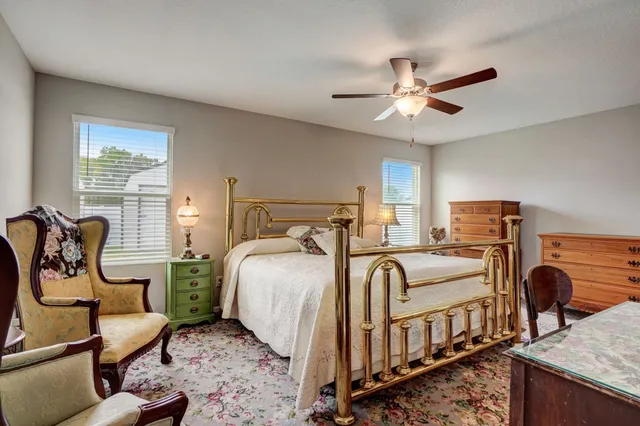 a bedroom with furniture and a window