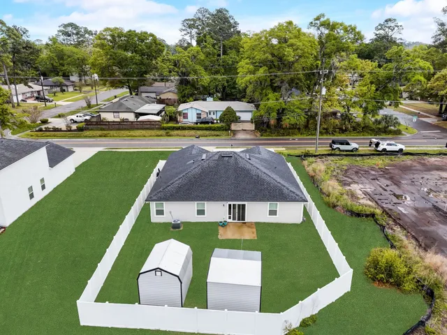 a view of a swimming pool with lawn chairs