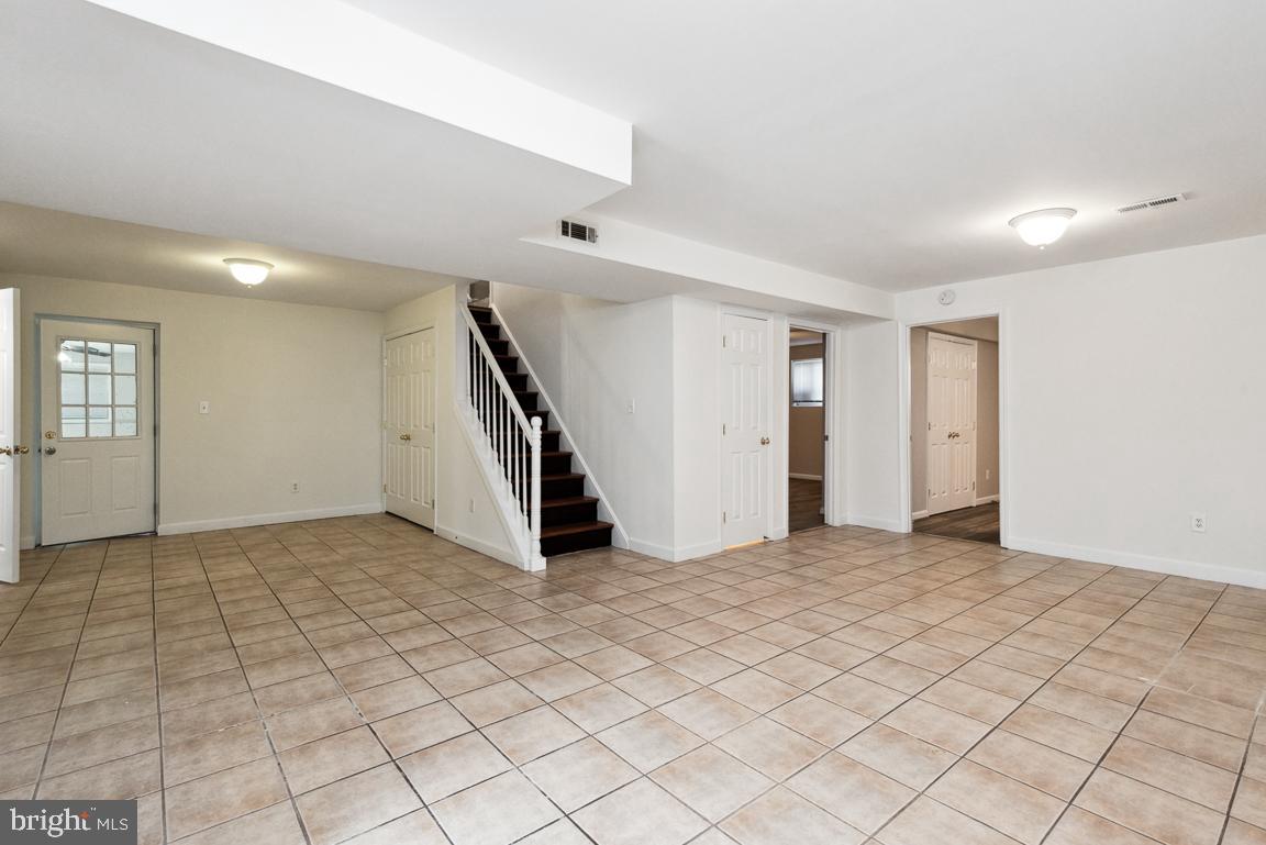 14016 Adkins Road Laurel, MD 20708 - Photo 28 of 54 Large tiled Basement